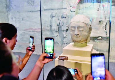 流失海外近百年 天龙山石窟佛首回归故土